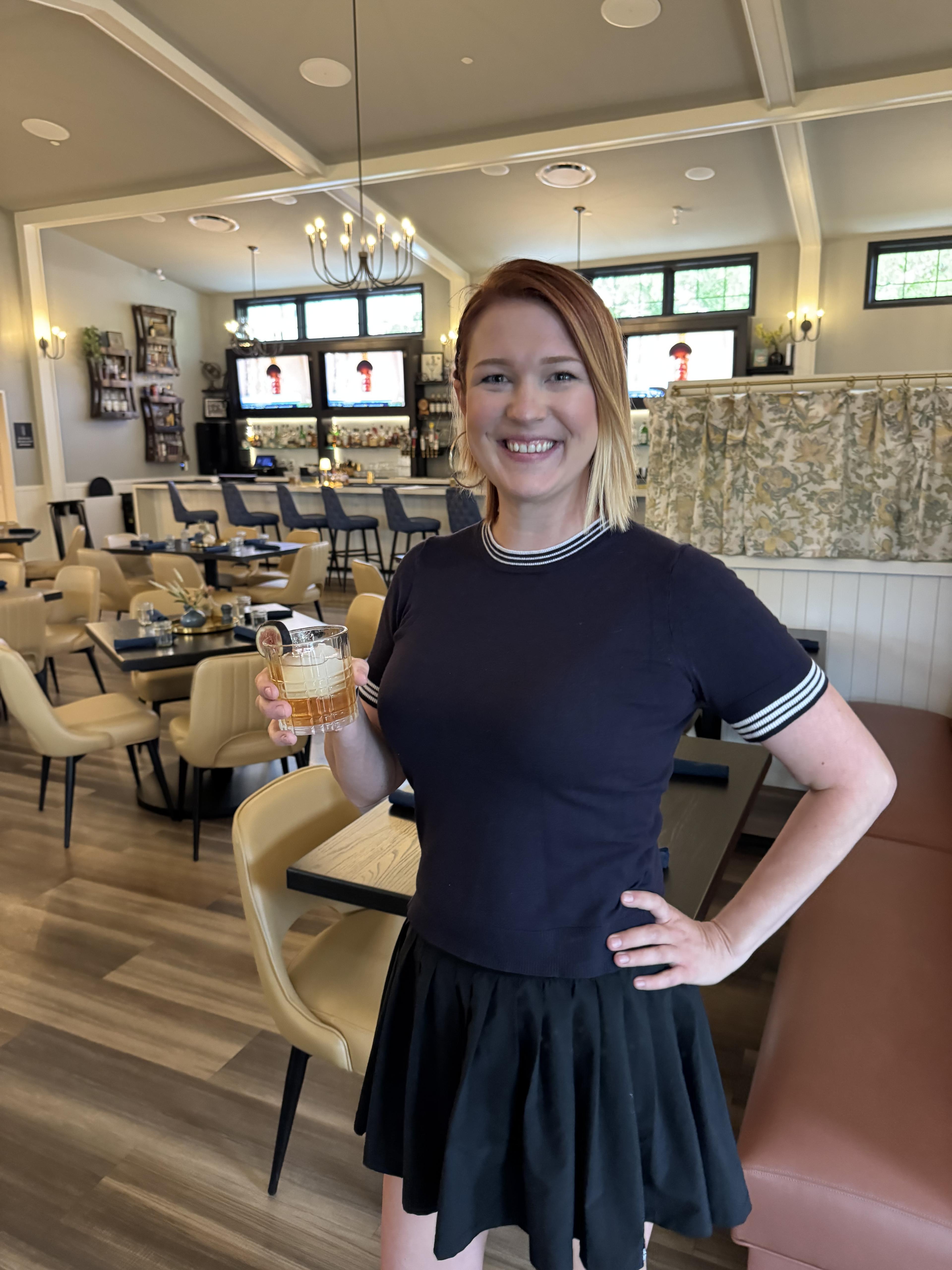 A guest enjoying Happy Hour at Fairways at GLC