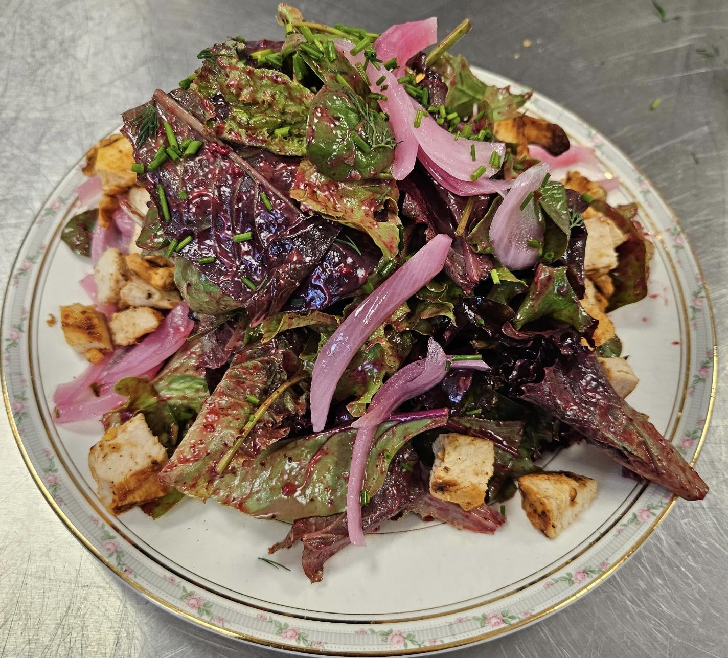 A beet and greens salad with grilled chicken at Fairways at GLC